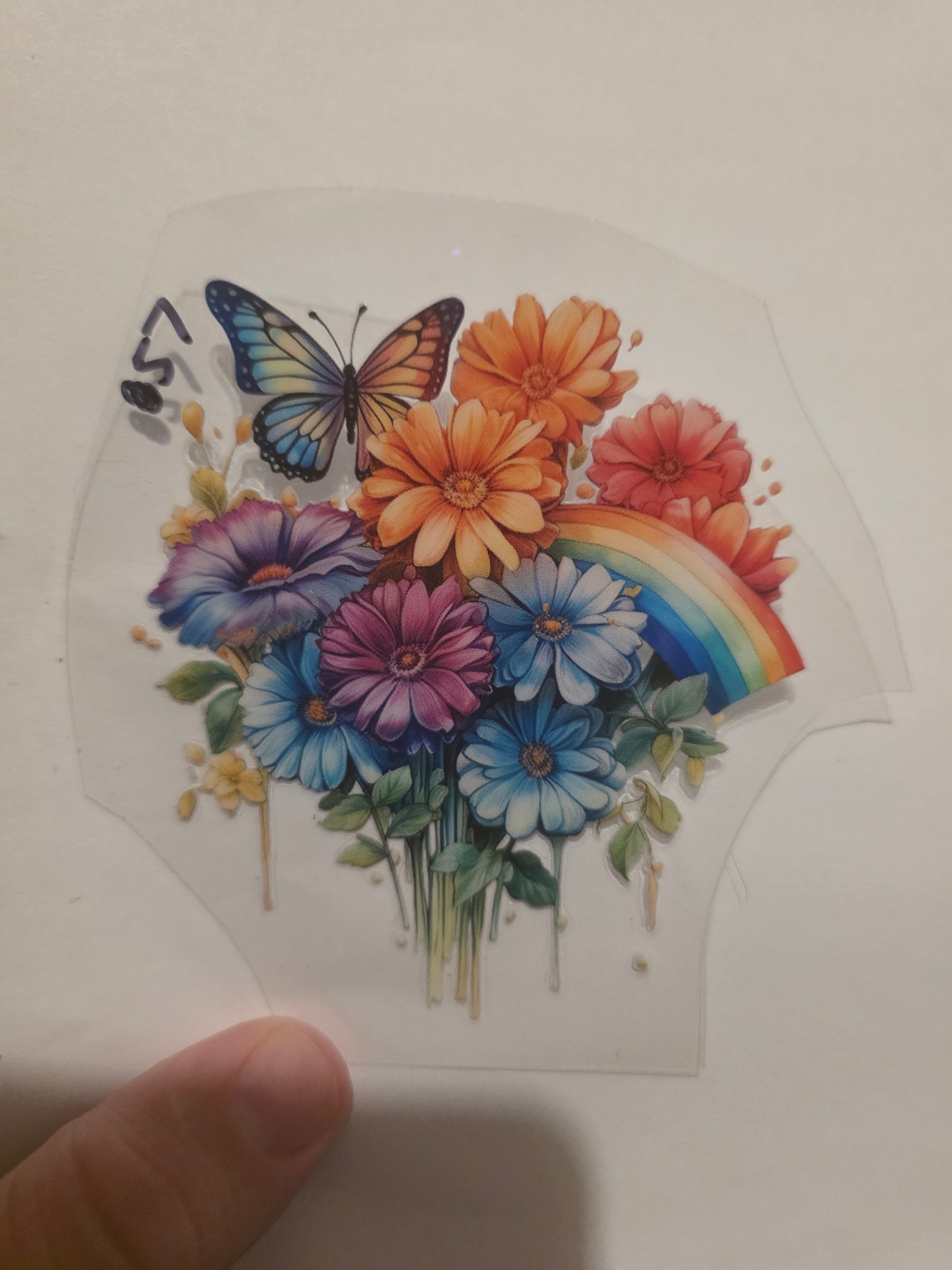 Flower with rainbow and butterfly