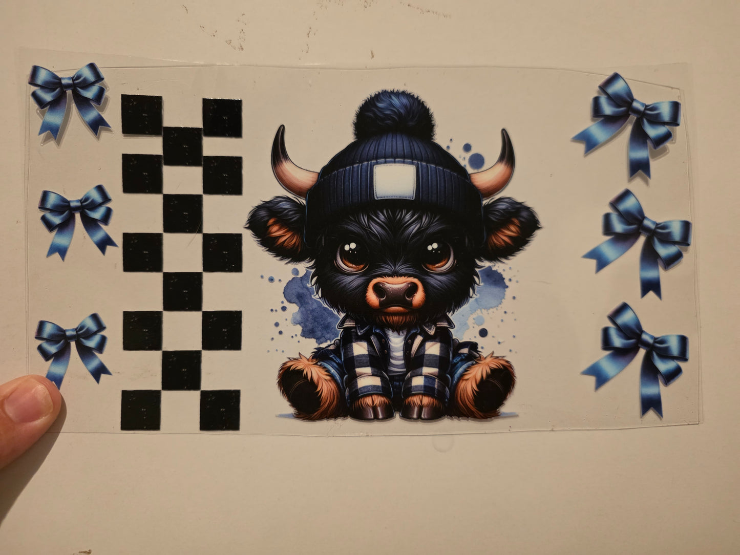 Highland cow with blue bows