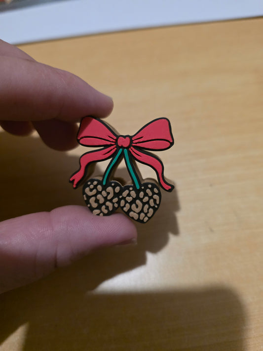 Cherries with a red bow
